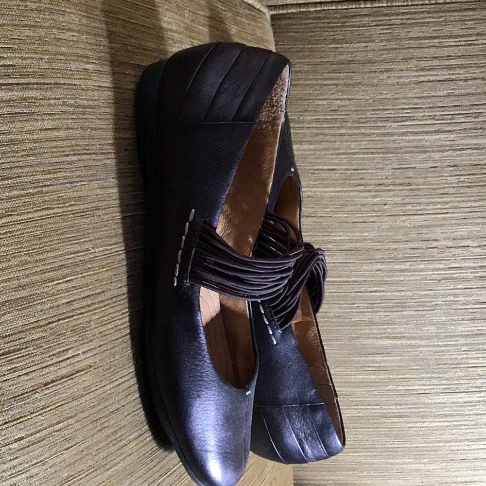 Brown leather flats